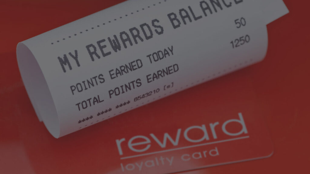 A loyalty rewards card and a receipt showing the points balance.